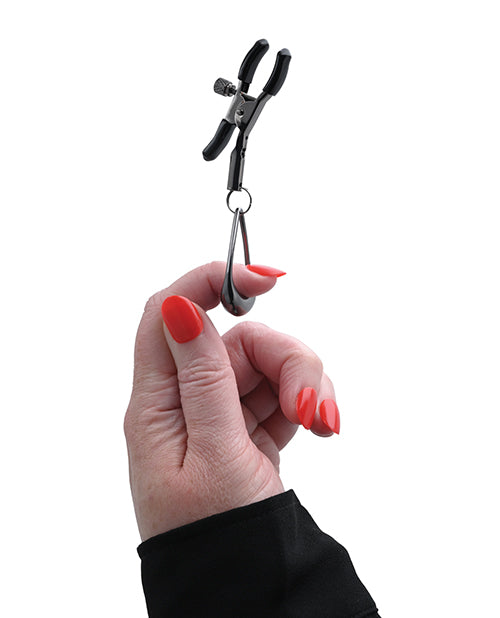 Hand holding tuggable nipple clamps