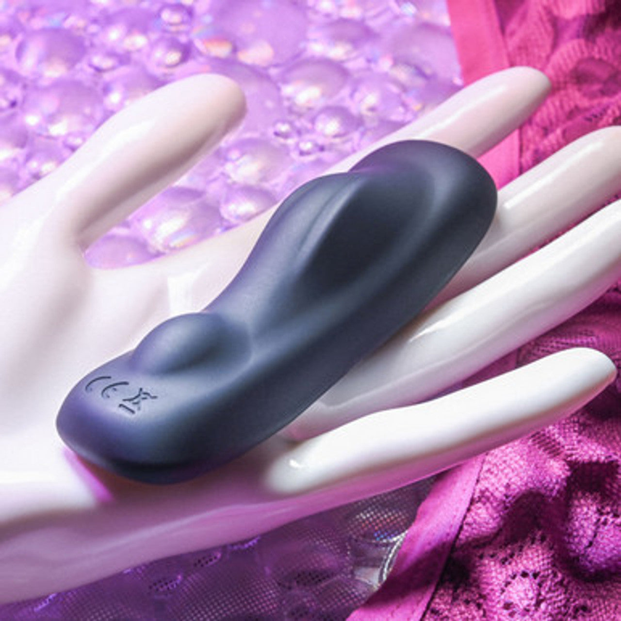 Black Gender X Our Undie Vibe on a hand with a purple textured background