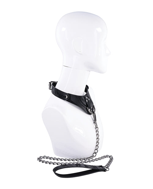 Black leather harness with chain on a mannequin bust against a white background
