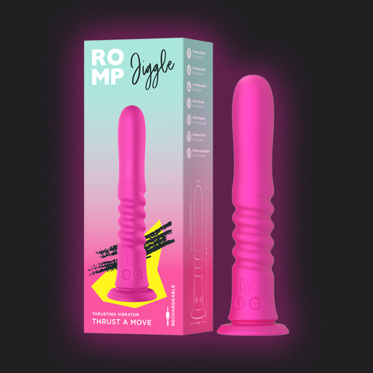 Pink toy with 'ROMP Jiggle' packaging on a dark background