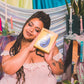 Woman holding Snail Vibe SVibe GIZI Lite in front of a colorful, decorative background