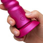 Hand holding a ROMP Jiggle Thrusting Vibrator with a brand logo on a white background