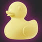 Yellow rubber duck sex toy vibrator on a purple background