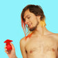 person with dyed hair holding a red vibrator against a blue background