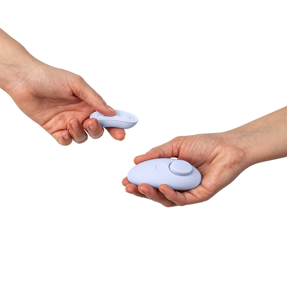 Two hands holding Dame Lay Panty Vibrator against a white background