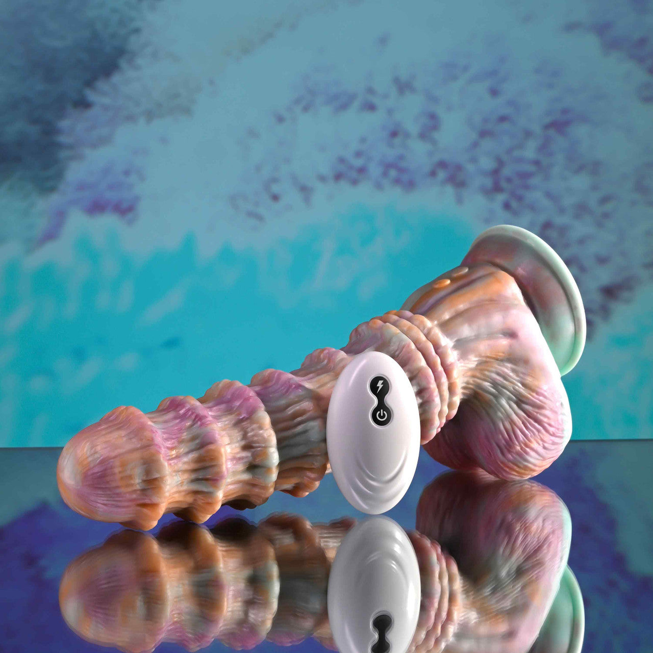 Colorful Evolved Fantasy Ridged Dildo with a white base on a reflective surface with a blue and purple abstract background