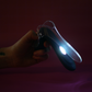INYA GynoVibe LED Speculum Vibrator glowing in the dark with it's internal light