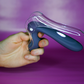 INYA GynoVibe LED Speculum Vibrator being held in hands, open