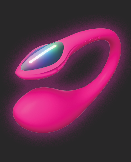 Pink internal vibrator Lovense Lush Mini with a glowing component on a dark background