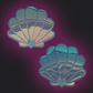 Two scallop shell designs on a dark purple background Pastease Opalescent Mermaid Shells