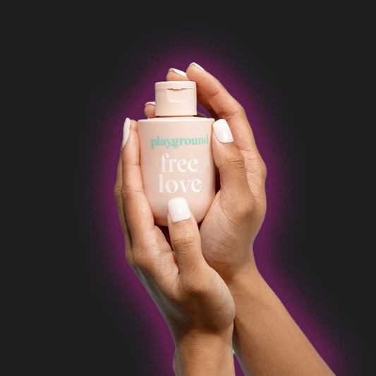 Playground Free Love Water Based Lubricant being held