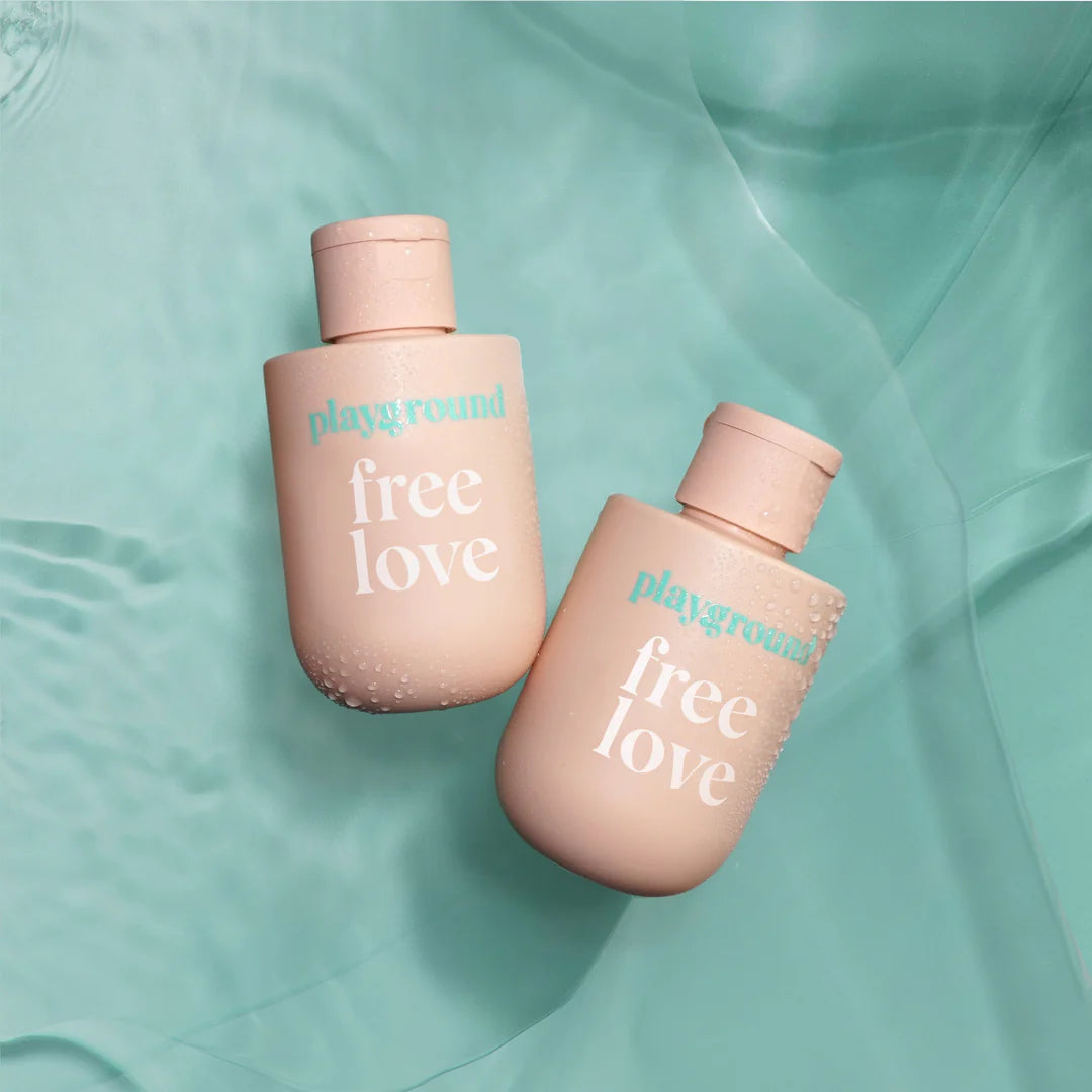 Playground Free Love Water Based Lubricant two bottles next to each other