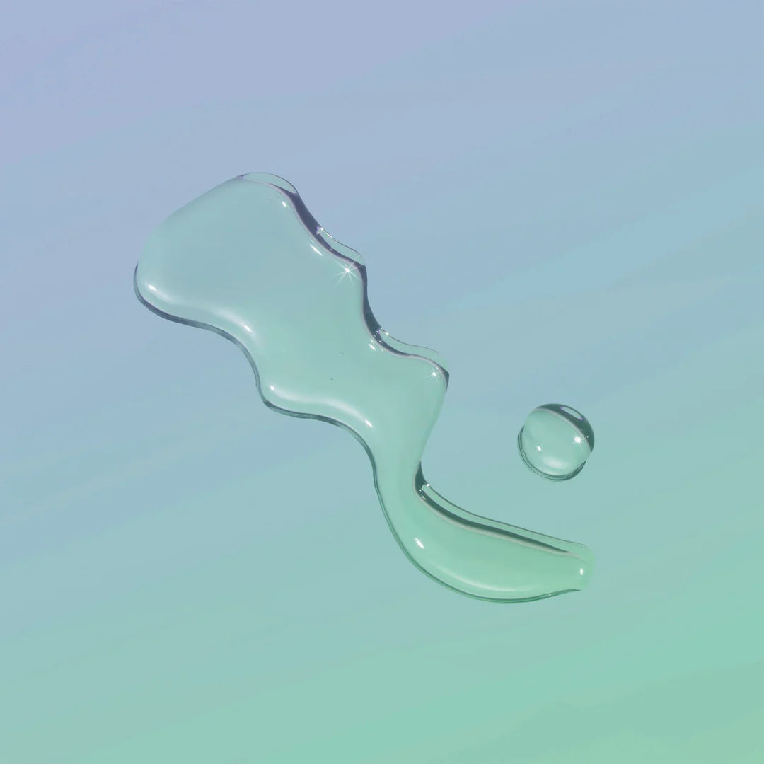 Playground Free Love Water Based Lubricant clear lube on glass