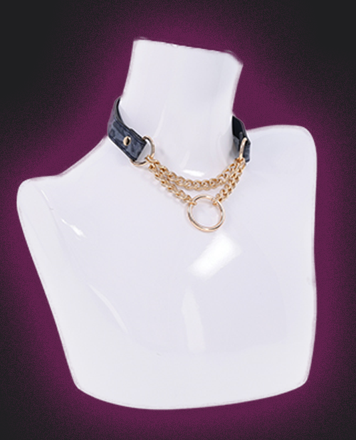 Gold chain necklace on a white mannequin bust against a purple background