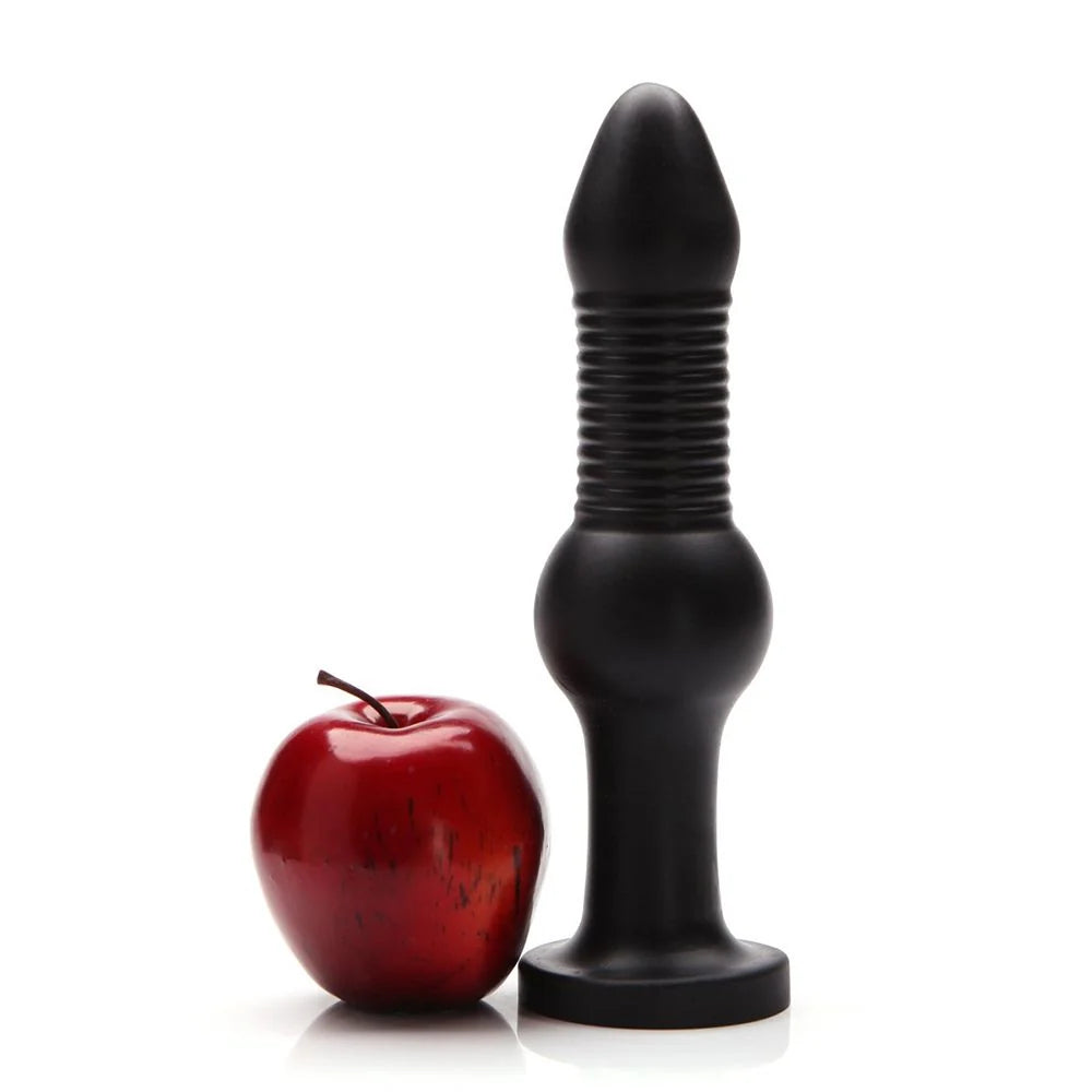 Tantus Fido Dildo black next to an apple for size 