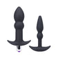 Two black silicone butt plugs with 'Tantus' branding on a white background