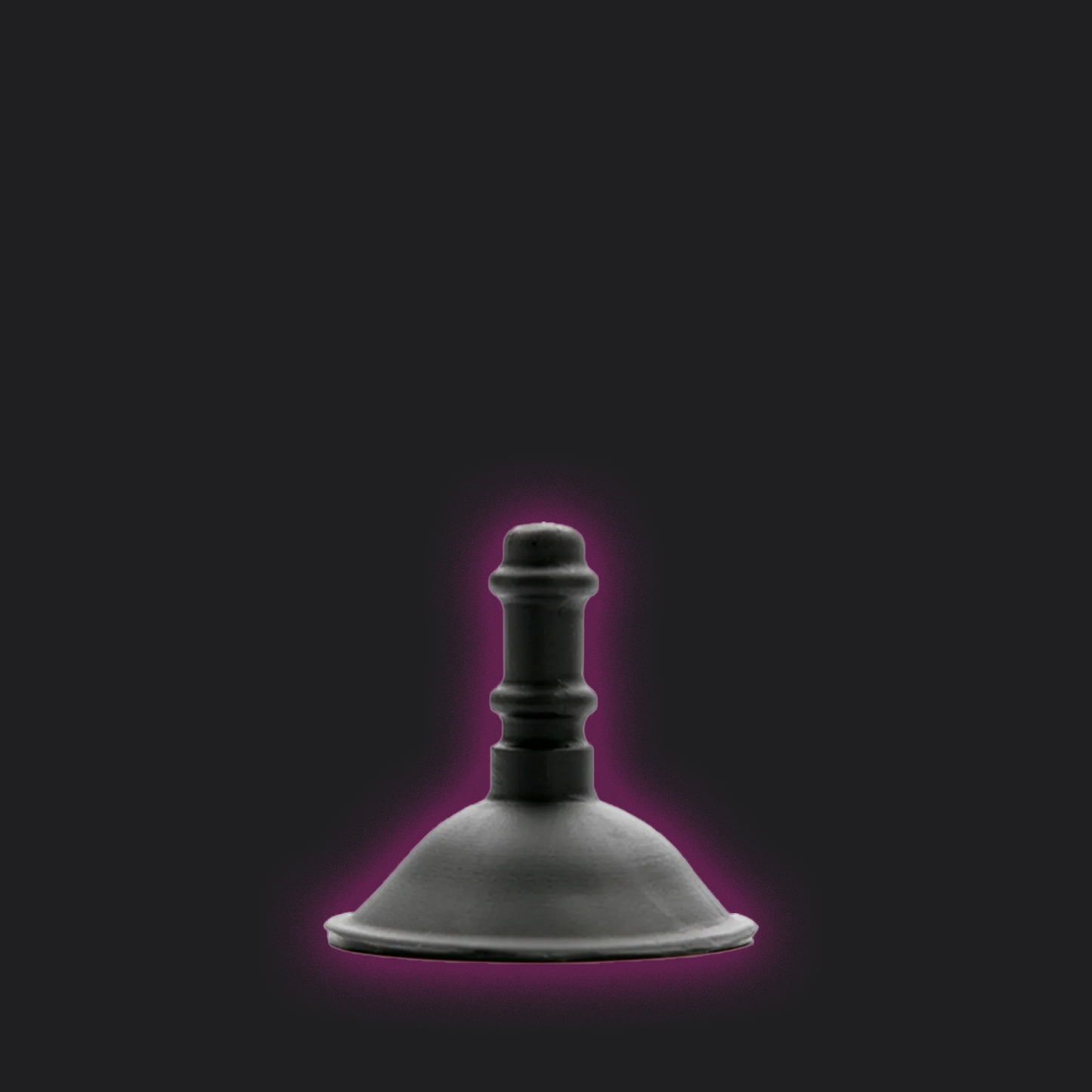 Black Tantus Suction Cup Dildo Attachment with a purple glow on a black background