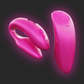 Two pink parts of the We-Vibe Chorus Couples Vibrator on a dark background