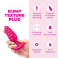 Pink textured vibrating butt plug held in a hand with product features listed on a pink background