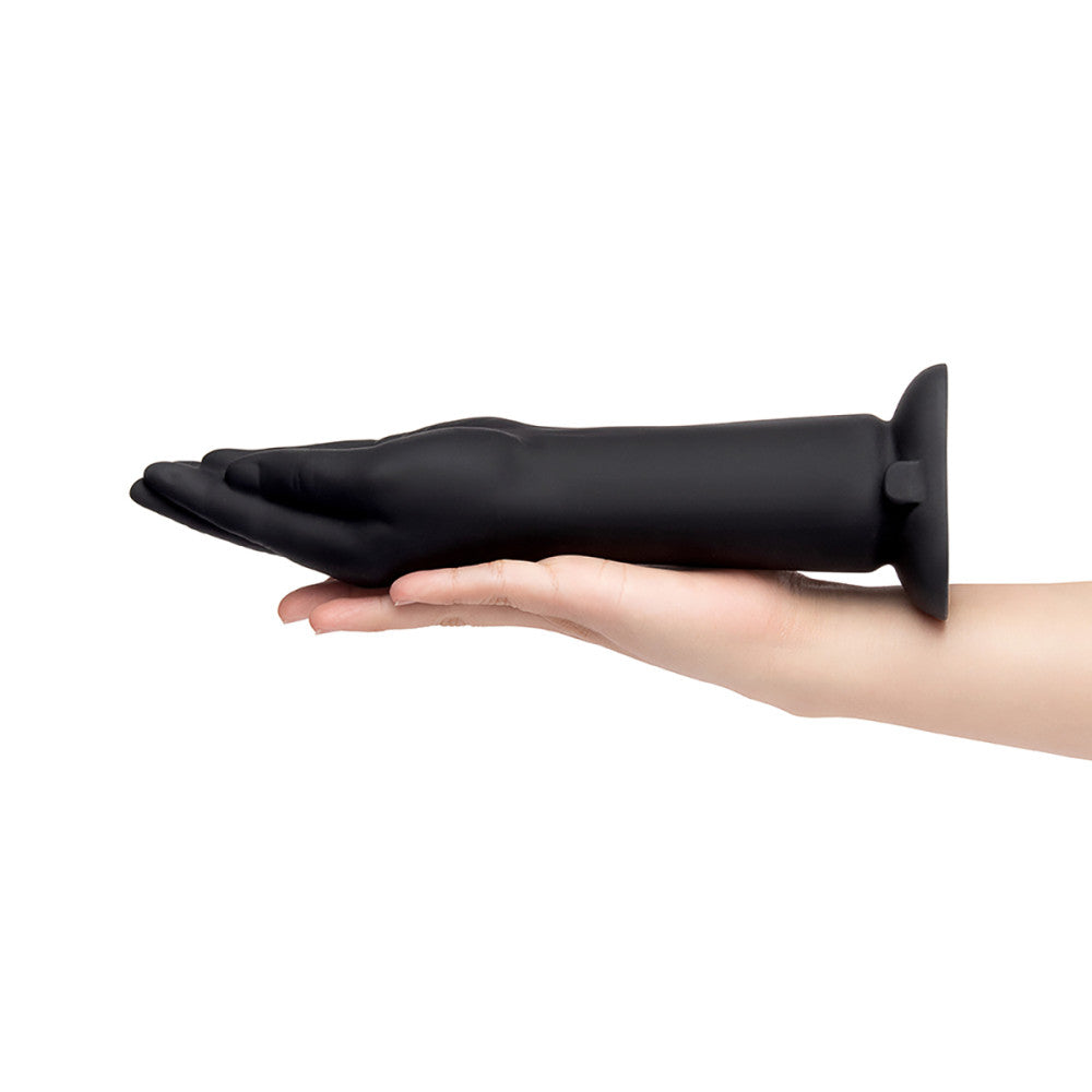 Black rubber glove on a hand against a white background