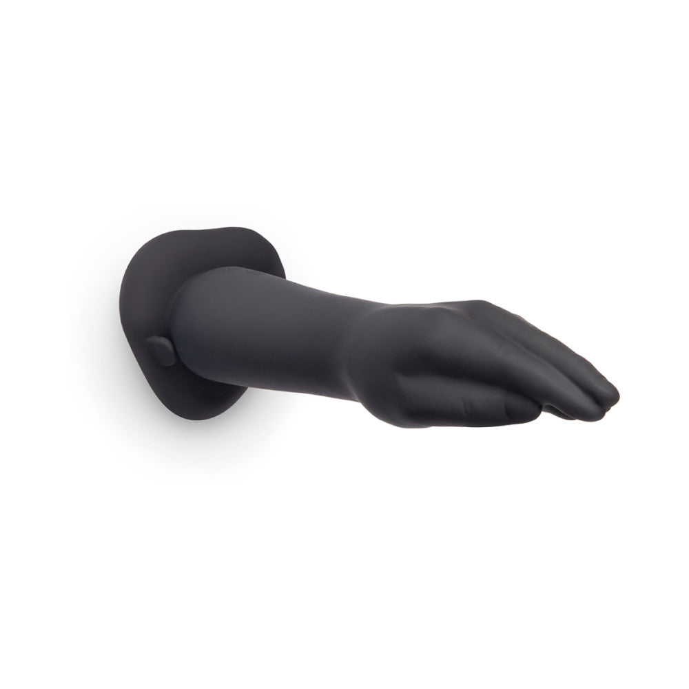 Black silicone dildo on a white background