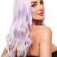 Woman with long, wavy, multicolored ella-wig-pastel-rainbow on a white background