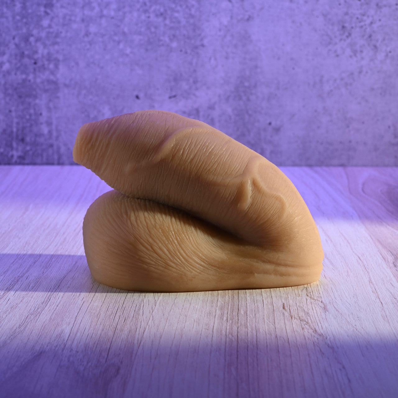 FTM packer on textured surface with a purple background