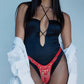 Person wearingthe Strap-on-Me Leatherette Harness Fabulous with a white shirt over shoulders against a light blue background