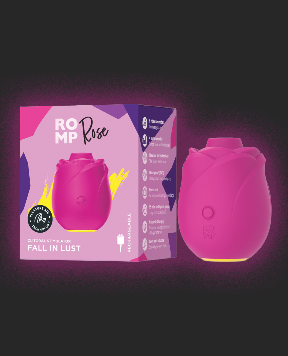 Pink ROMP Rose vibrator with packaging on a dark background