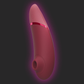 Pink and red Womanizer Next 3D Pleasure Air Vibrator on a dark background